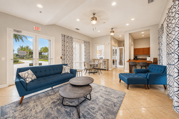 Lauderdale Lakes apartment for rent - A living room with a blue couch and a coffee table.