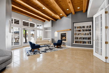 Sante Fe apartment for rent - A living room with a blue chair and a fireplace.