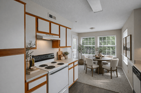 Grandview apartment for rent - A kitchen with a dining table and chairs.