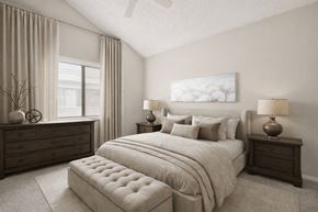 Arvada apartment for rent - A bedroom with a large bed, a dresser, and a window with curtains.