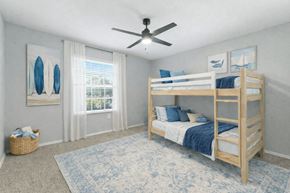 Orlando apartment for rent - A bedroom with a bunk bed and a ceiling fan. at Waterbridge Apartments , Orlando, FL, 32837