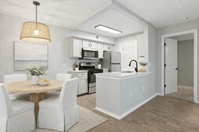 Orlando apartment for rent - A modern kitchen with a dining table and chairs. at Waterbridge Apartments , Orlando, 32837