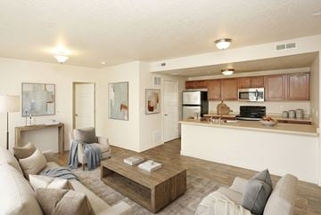 Salt Lake City apartment for rent - A modern living room with a white couch and a coffee table.
