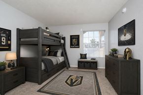 Henderson apartment for rent - A bedroom with a bunk bed and a rug with a lightning bolt design.