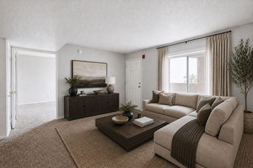 Henderson apartment for rent - A living room with a brown sofa and a coffee table.