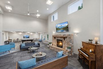 Billings apartment for rent - A living room with a fireplace and a television mounted on the wall.