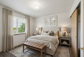 Billings apartment for rent - A bedroom with a large bed and a window with curtains.