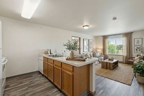 Billings apartment for rent - A kitchen with wooden cabinets and a white countertop.