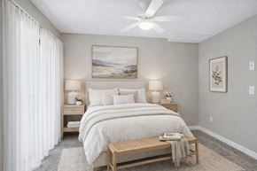Concord apartment for rent - Neutral bedroom with ceiling fan and artwork at Davidson Homes Apartments, Concord