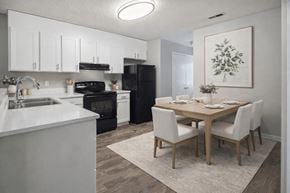 Concord apartment for rent - Modern kitchen and dining area with white cabinetry at Davidson Homes Apartments, North Carolina