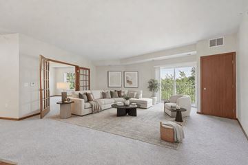 Andover apartment for rent - A spacious living room with a white couch and a rug.