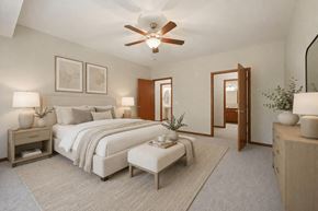 Andover apartment for rent - A bedroom with a large bed and a ceiling fan.