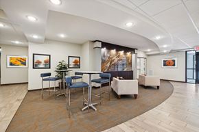 Maple Grove apartment for rent - A conference room with a long table and chairs.
