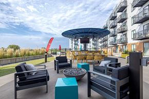 Minneapolis apartment for rent - Rooftop terrace with firepit and outdoor seating at Hello Apartments, Minneapolis