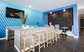Minneapolis apartment for rent - A blue and white kitchen with a bar area.