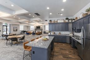 South Jordan apartment for rent - A modern kitchen with dark blue cabinets and a central island.