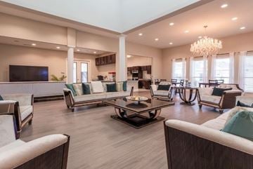 Allen apartment for rent - A spacious living room with a large sofa set and a chandelier.