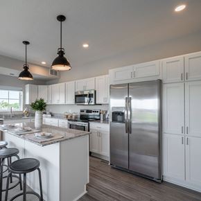 Falcon Heights apartment for rent - A modern kitchen with white cabinets and a large island.