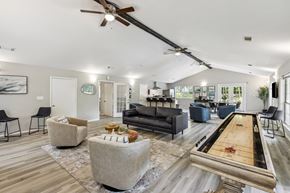 College Park townhouse for rent - A room with a pool table and a ceiling fan.