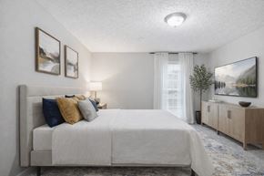 Stone Mountain townhouse for rent - Bedroom with neutral decor and natural light at Linden Ridge Apartments, Stone Mountain, 30083