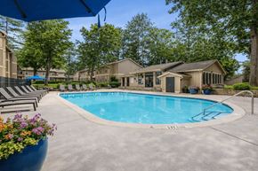 Stone Mountain townhouse for rent - Outdoor swimming pool with lounge chairs and clubhouse at Linden Ridge Apartments, Stone Mountain