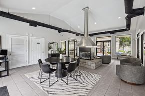 Stone Mountain townhouse for rent - Clubhouse lounge with central fireplace and seating at Linden Ridge Apartments, Stone Mountain, GA 30083
