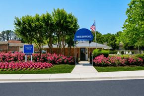 Morrow townhouse for rent - The Morrowood sign is blue and white with an American flag on it.