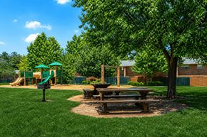 Morrow townhouse for rent - A playground with a green slide and picnic table.