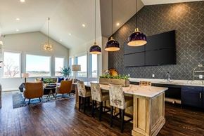 Denver apartment for rent - Open kitchen with island and herringbone backsplash at Connect at First Creek Apartments, Denver, Colorado
