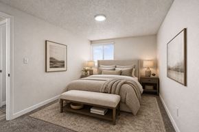 Midvale apartment for rent - A bedroom with a large bed and two lamps.