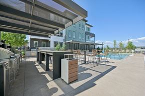 Englewood apartment for rent - Outdoor kitchen with pool and bar seating at Sequel Homes Apartments, Englewood, CO