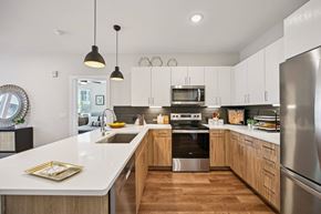 Englewood apartment for rent - Modern kitchen with two tone wood cabinetry at Sequel Homes Apartments, Colorado