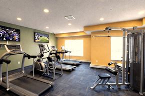 St Cloud apartment for rent - A gym with treadmills, exercise bikes, and other equipment.