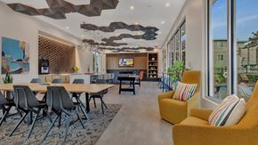 Waite Park apartment for rent - Modern clubhouse with dining area and lounge seating at Prosper West Apartments, Minnesota, 56387
