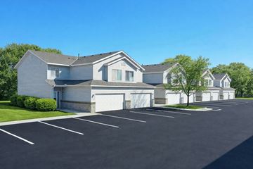 St Cloud apartment for rent - A large house with a garage and a driveway in front.