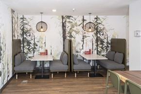 St Cloud apartment for rent - A dining area with a table surrounded by grey chairs.