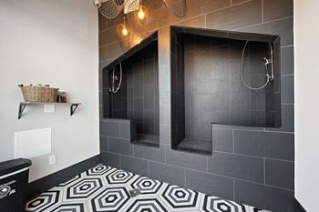 Pet spa with tile shower stations and floor mat
