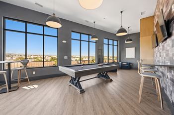 Recreation room with billiards table and lounge seating