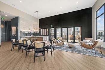 Community lounge with dining tables and seating areas