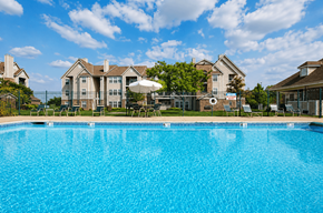 Grandview apartment for rent - A large swimming pool in front of a residential area.
