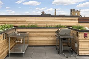Minneapolis apartment for rent - A small outdoor kitchen with a sink and grill.