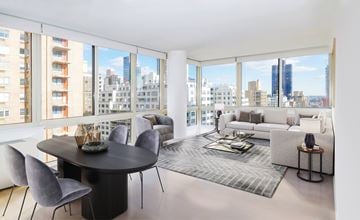 New York apartment for rent - A modern living room with a large table and chairs.