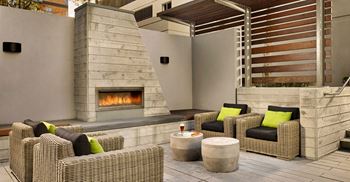 Outdoor dining area with bbqs and fireplace