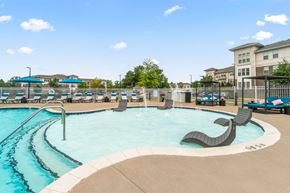 Charlotte apartment for rent - resort style pool with lounge chairs on in-water ledge at Sycamore at Tyvola, Charlotte