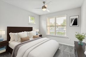 Pooler apartment for rent - a bedroom with a large bed and two windows at Two Addison Place Apartments , Georgia