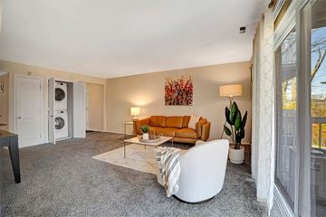 Towson apartment for rent - a living room with a couch and a washing machine