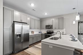 Daniel Island apartment for rent - a large kitchen with stainless steel appliances and white counter tops  at Central Island Square, South Carolina