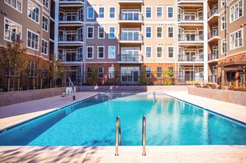 Empty pool in front of an apartment building