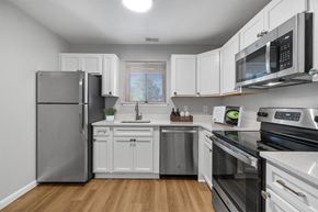 Annapolis apartment for rent - a kitchen with stainless steel appliances and white cabinets at Westwinds Apartments, Annapolis