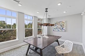 Daniel Island apartment for rent - a dining room with a table and chairs and windows at Central Island Square, Daniel Island, 29492